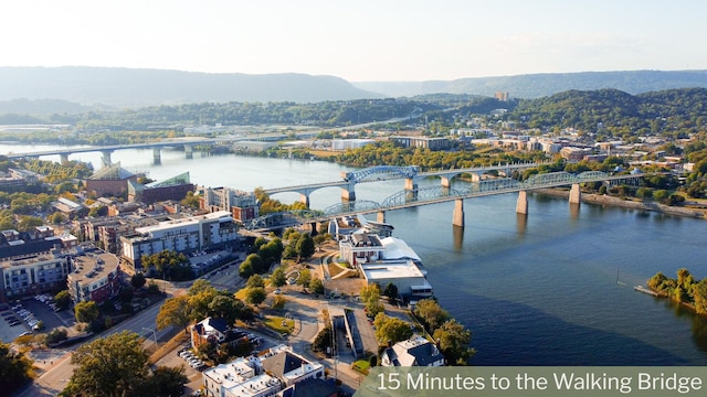 bird's eye view with a water and mountain view