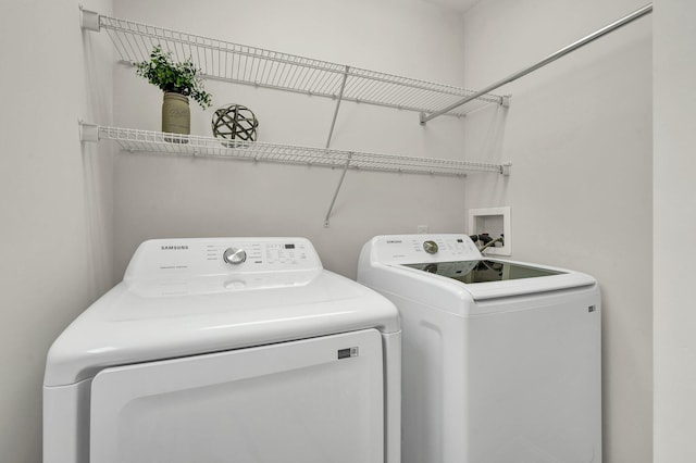 laundry area with laundry area and separate washer and dryer