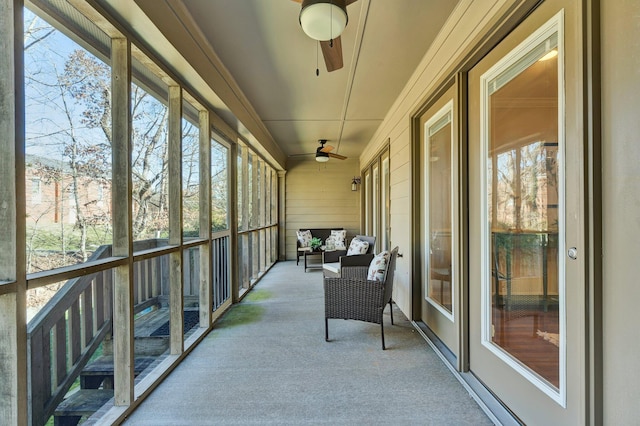 sunroom with a ceiling fan