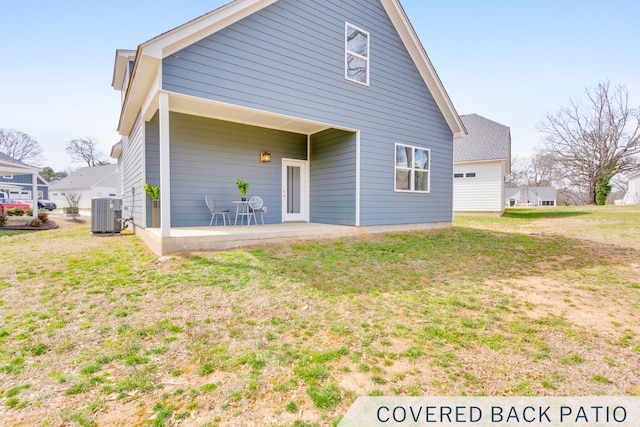 back of house featuring a patio area, central AC unit, and a lawn