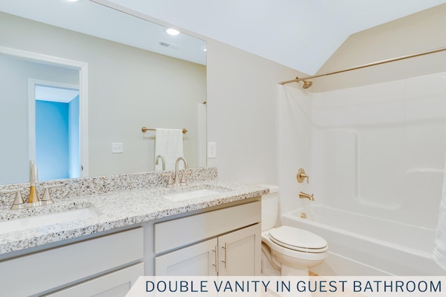 full bath featuring a sink, visible vents, toilet, and double vanity