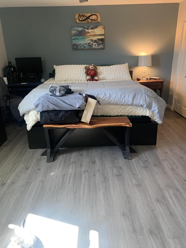 bedroom featuring wood finished floors