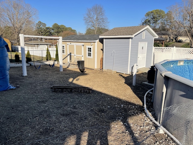 exterior space with a fenced in pool and a fenced backyard