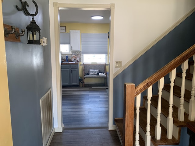 interior space featuring wood finished floors and visible vents