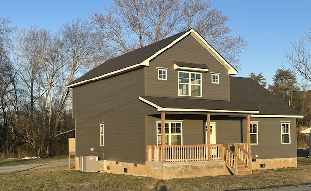 view of front of property featuring crawl space, covered porch, and cooling unit