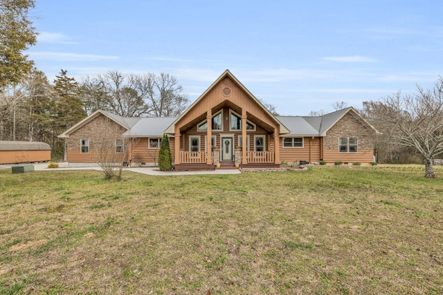 view of front of house with metal roof, a front lawn, and crawl space