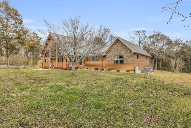 back of house with a yard