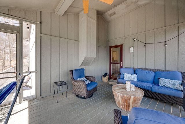 exterior space featuring lofted ceiling with beams and visible vents