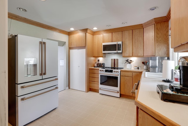 kitchen with white appliances, ornamental molding, light countertops, backsplash, and recessed lighting