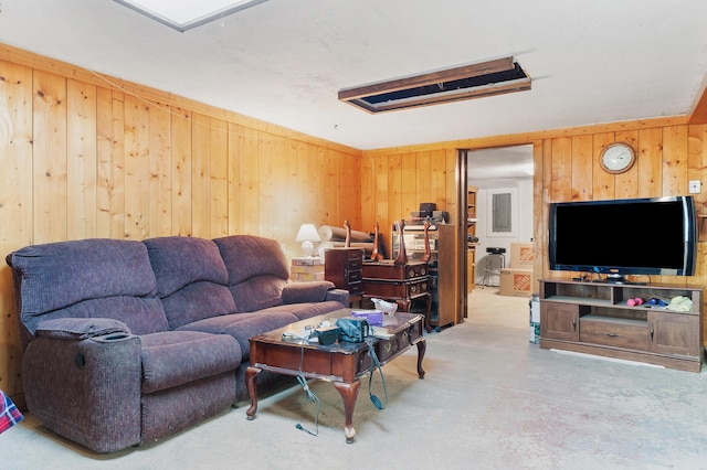 living room with concrete floors and wooden walls