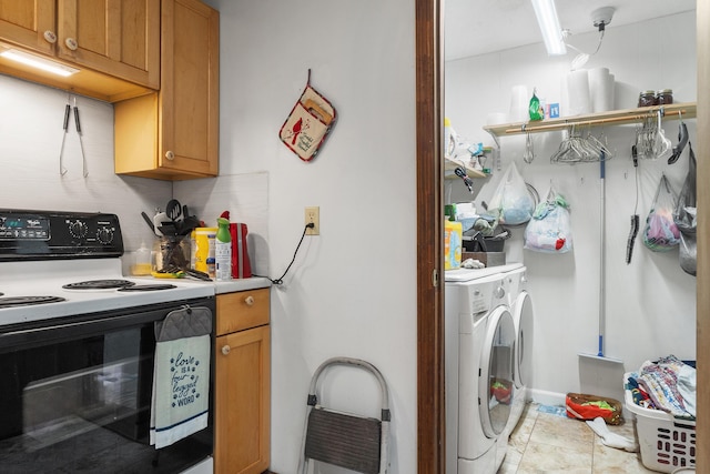 clothes washing area with laundry area and light tile patterned floors