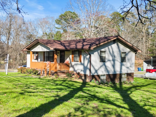 view of front of home with covered porch and a front lawn