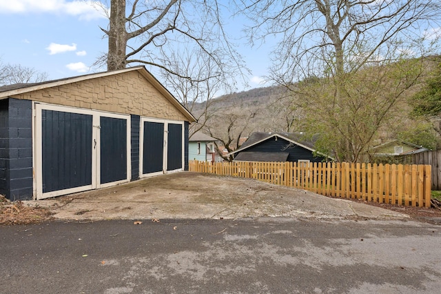 garage featuring fence