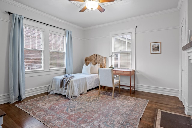 bedroom featuring multiple windows, wood finished floors, and crown molding