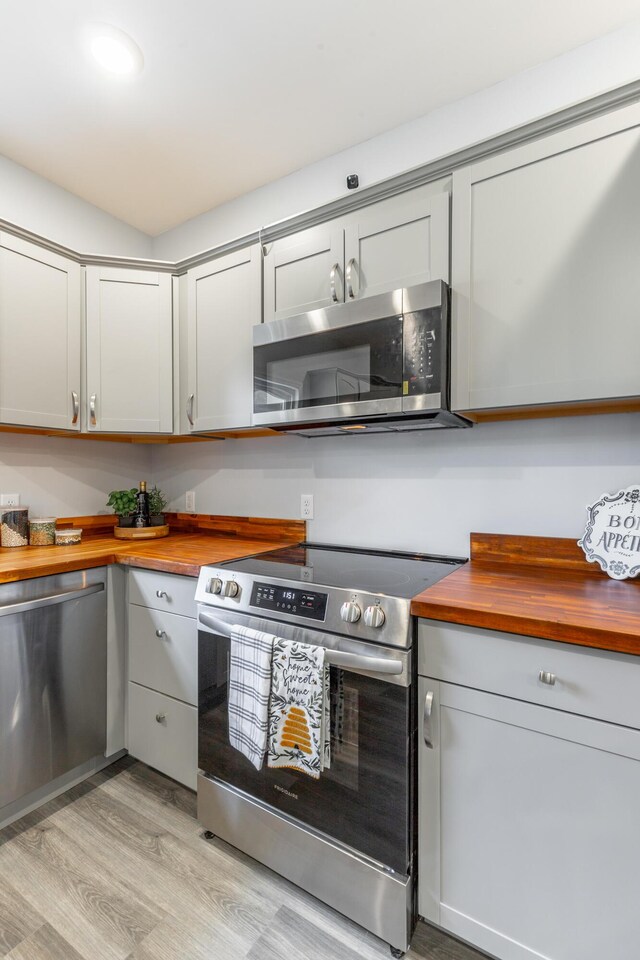 4513 Lamont Ln, Chattanooga, TN 37415 - kitchen featuring wood counters, appliances with stainless steel finishes, light wood-style flooring, and gray cabinets