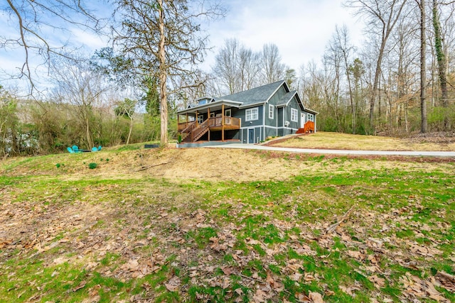 4513 Lamont Ln, Chattanooga, TN 37415 - rear view of property featuring a lawn, stairs, and a deck
