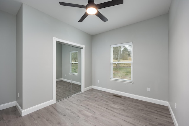 unfurnished room with plenty of natural light, visible vents, and baseboards