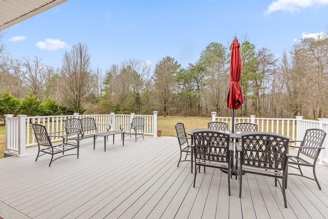 wooden deck featuring outdoor dining space