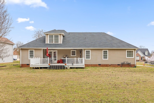 back of property featuring crawl space, roof with shingles, a yard, and a wooden deck