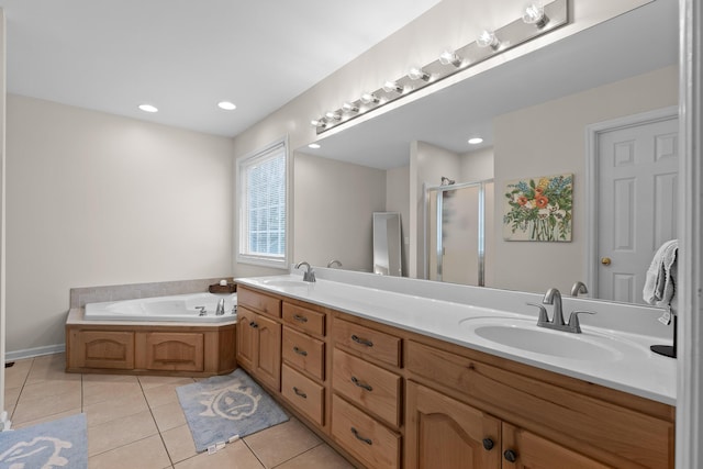 bathroom featuring a sink, a shower stall, a bath, and tile patterned floors