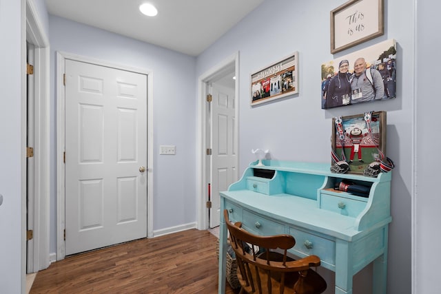 interior space featuring baseboards, wood finished floors, and recessed lighting