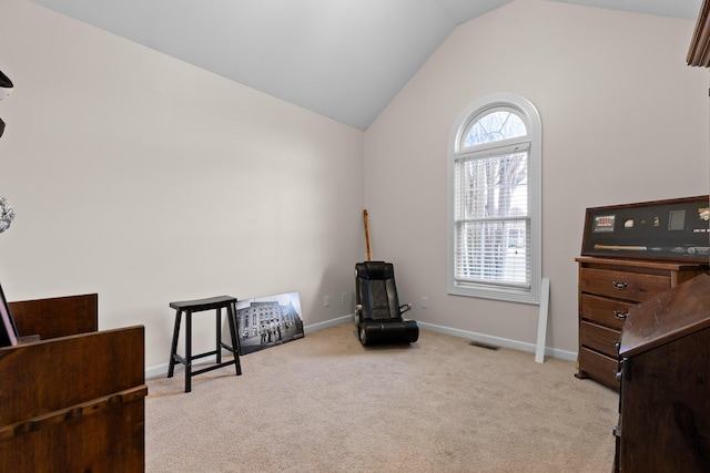 sitting room featuring carpet floors, lofted ceiling, visible vents, and baseboards