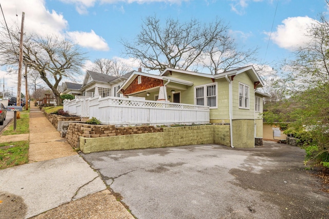 view of property exterior with fence