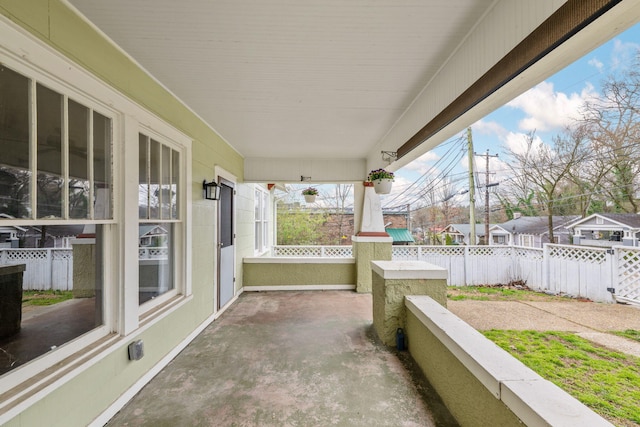 view of patio / terrace featuring fence