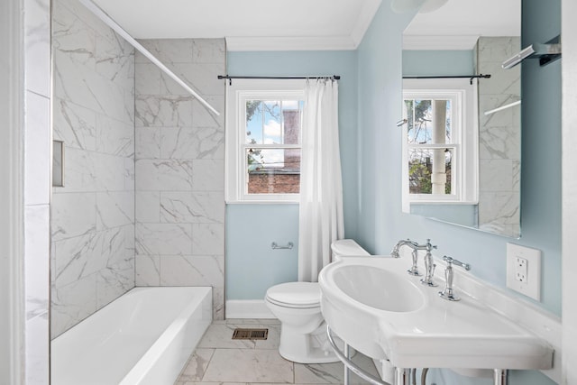 bathroom with a wealth of natural light, marble finish floor, visible vents, and toilet