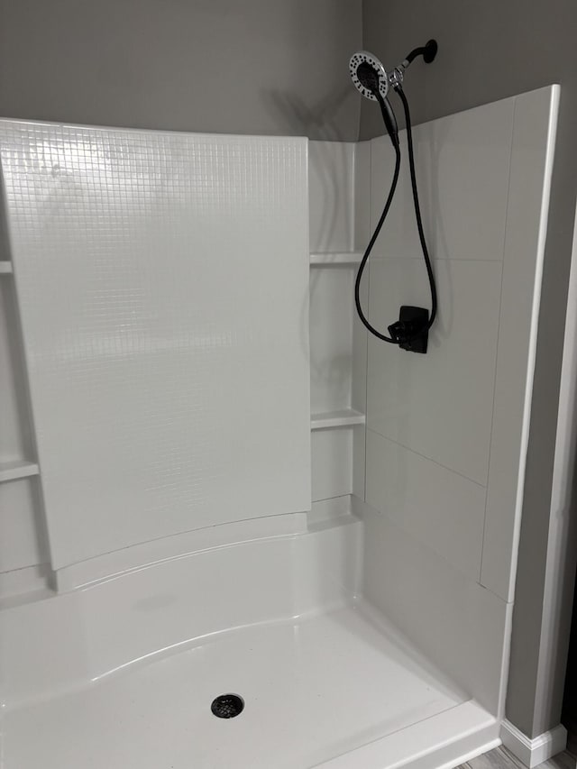 full bathroom featuring a stall shower