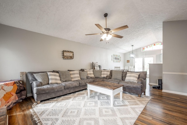 living room with baseboards, a ceiling fan, lofted ceiling, wood finished floors, and a textured ceiling