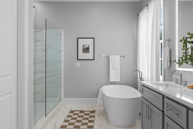 1109 Meroney St, Chattanooga, TN 37405 - full bathroom featuring vanity, a freestanding bath, marble finish flooring, and tiled shower