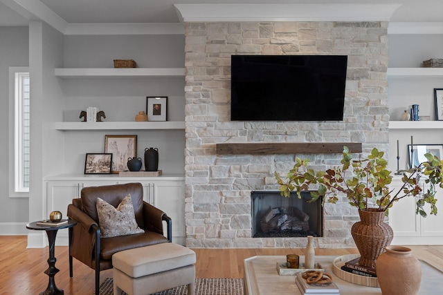 1109 Meroney St, Chattanooga, TN 37405 - living area featuring a stone fireplace, ornamental molding, wood finished floors, and built in features