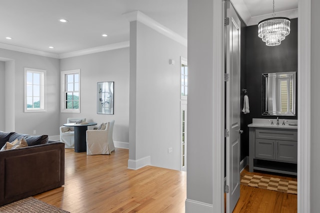 1109 Meroney St, Chattanooga, TN 37405 - hall with light wood-type flooring, crown molding, a chandelier, and recessed lighting