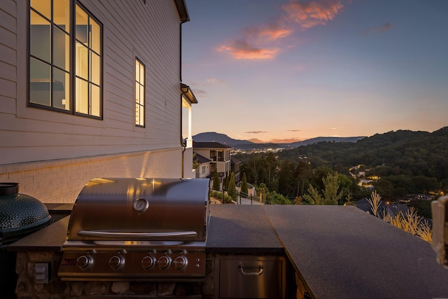 1109 Meroney St, Chattanooga, TN 37405 - patio terrace at dusk featuring a grill and a mountain view