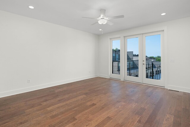 unfurnished room with recessed lighting, french doors, dark wood finished floors, and baseboards