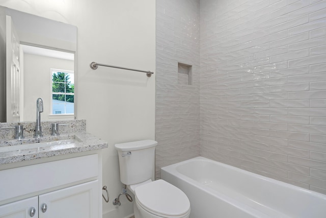 bathroom featuring bathing tub / shower combination, vanity, and toilet