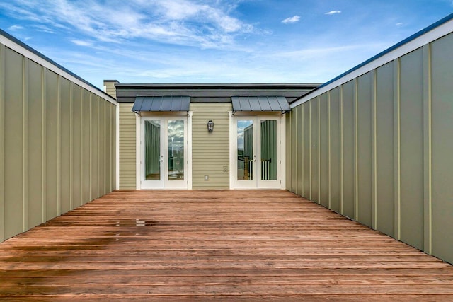 wooden deck featuring french doors