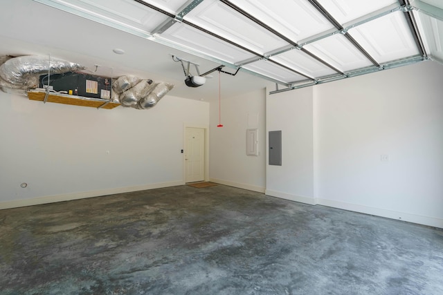 garage featuring electric panel, baseboards, and a garage door opener