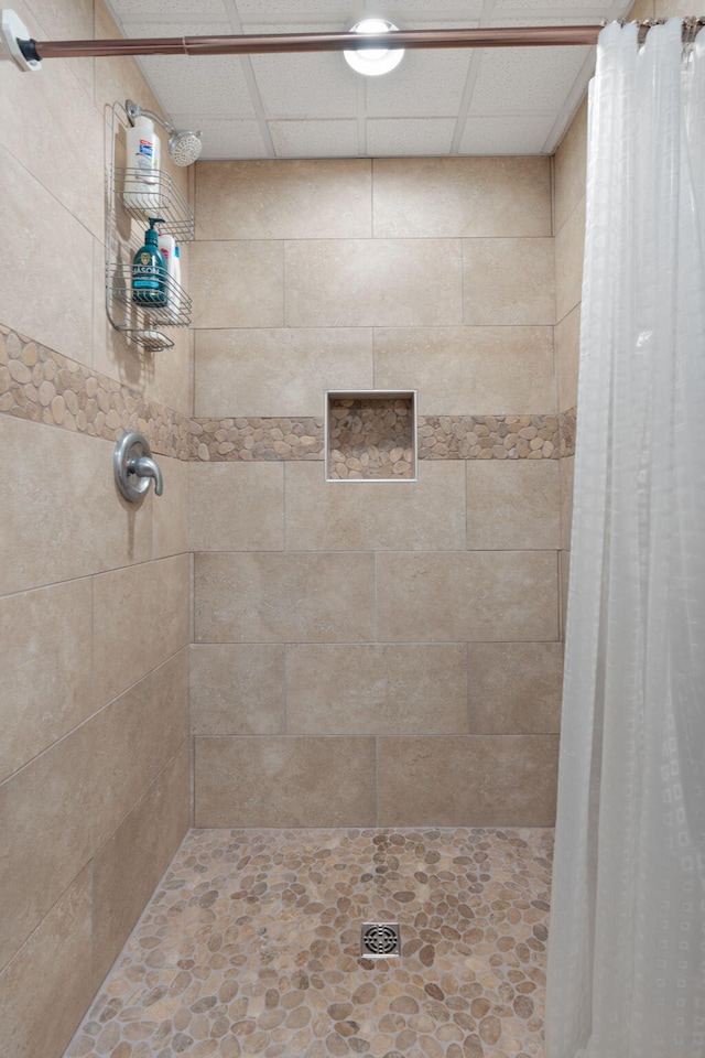 full bath featuring a tile shower