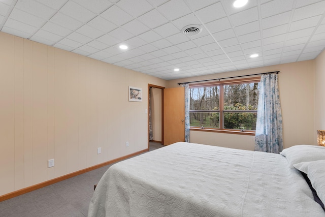 carpeted bedroom featuring recessed lighting, visible vents, and baseboards