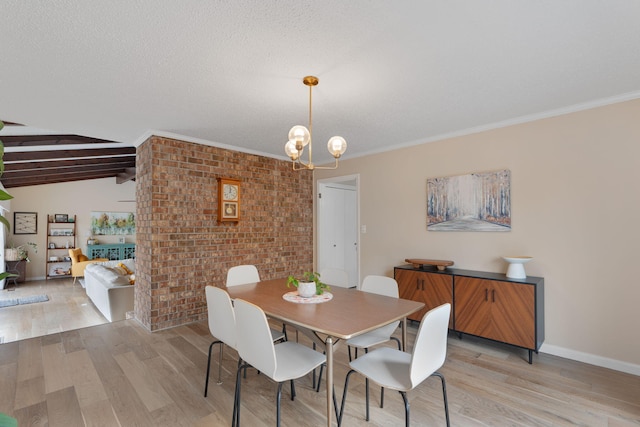 dining space featuring vaulted ceiling with beams, a notable chandelier, ornamental molding, brick wall, and light wood-type flooring