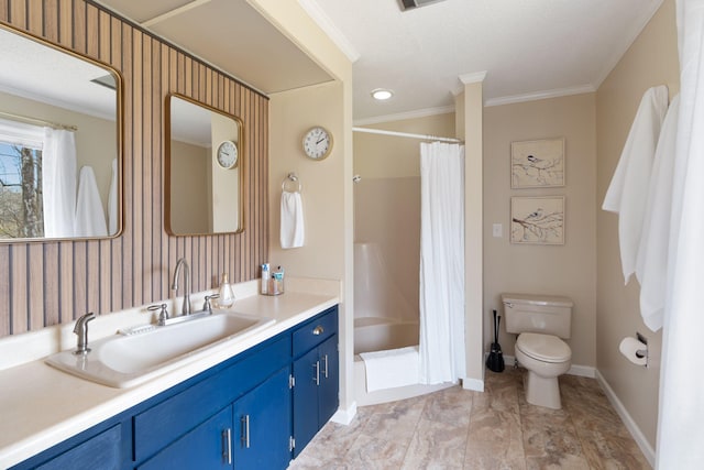 bathroom with ornamental molding, a shower with curtain, vanity, and toilet