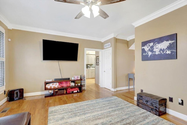 rec room featuring visible vents, ornamental molding, and wood finished floors