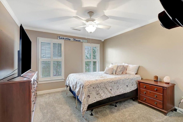 bedroom with ornamental molding, light colored carpet, ceiling fan, and baseboards