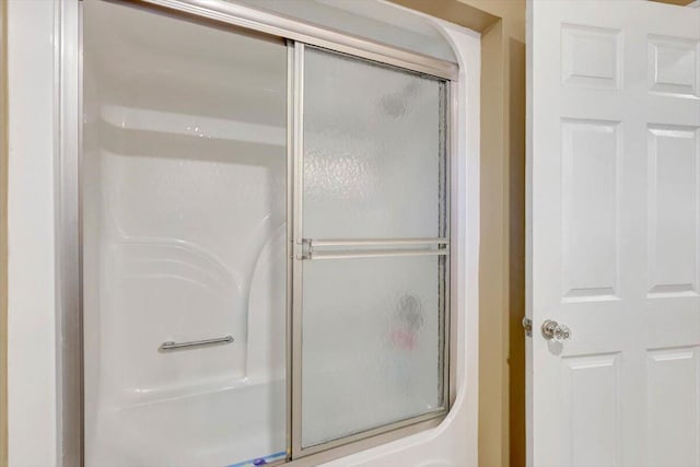 full bathroom with a shower stall