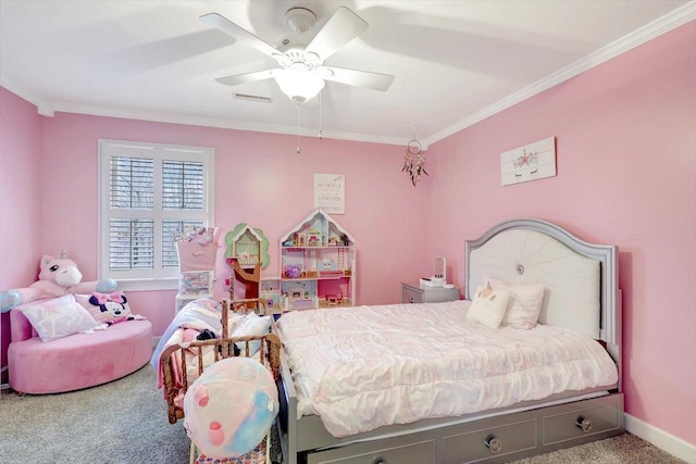 carpeted bedroom with baseboards, visible vents, ornamental molding, and a ceiling fan