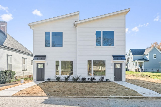 view of front facade featuring a standing seam roof and metal roof