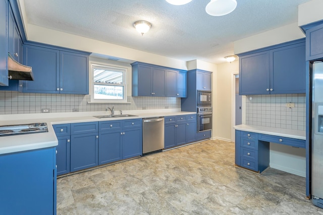 kitchen featuring a sink, decorative backsplash, black appliances, light countertops, and blue cabinets