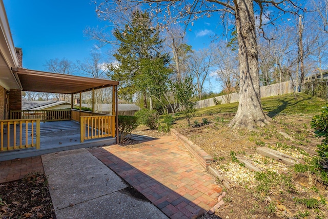 view of yard featuring a wooden deck and a fenced backyard